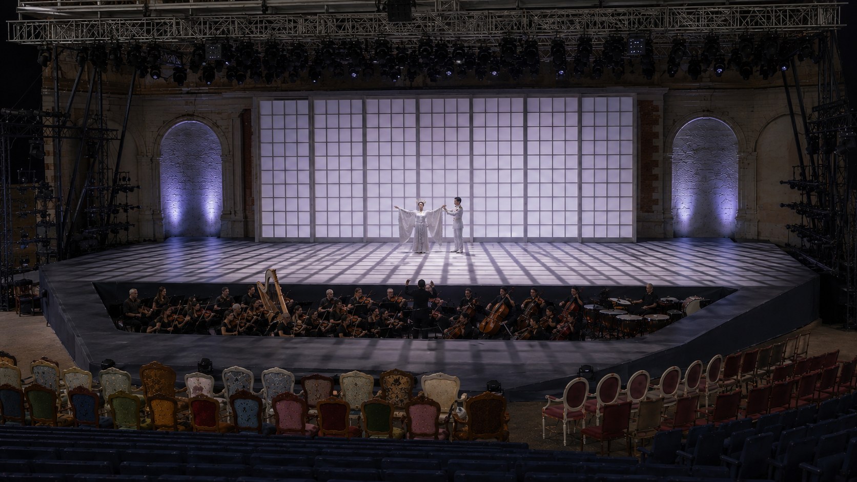 Love duet: grid light on the floor, Pinkerton arranging Cio-Cio